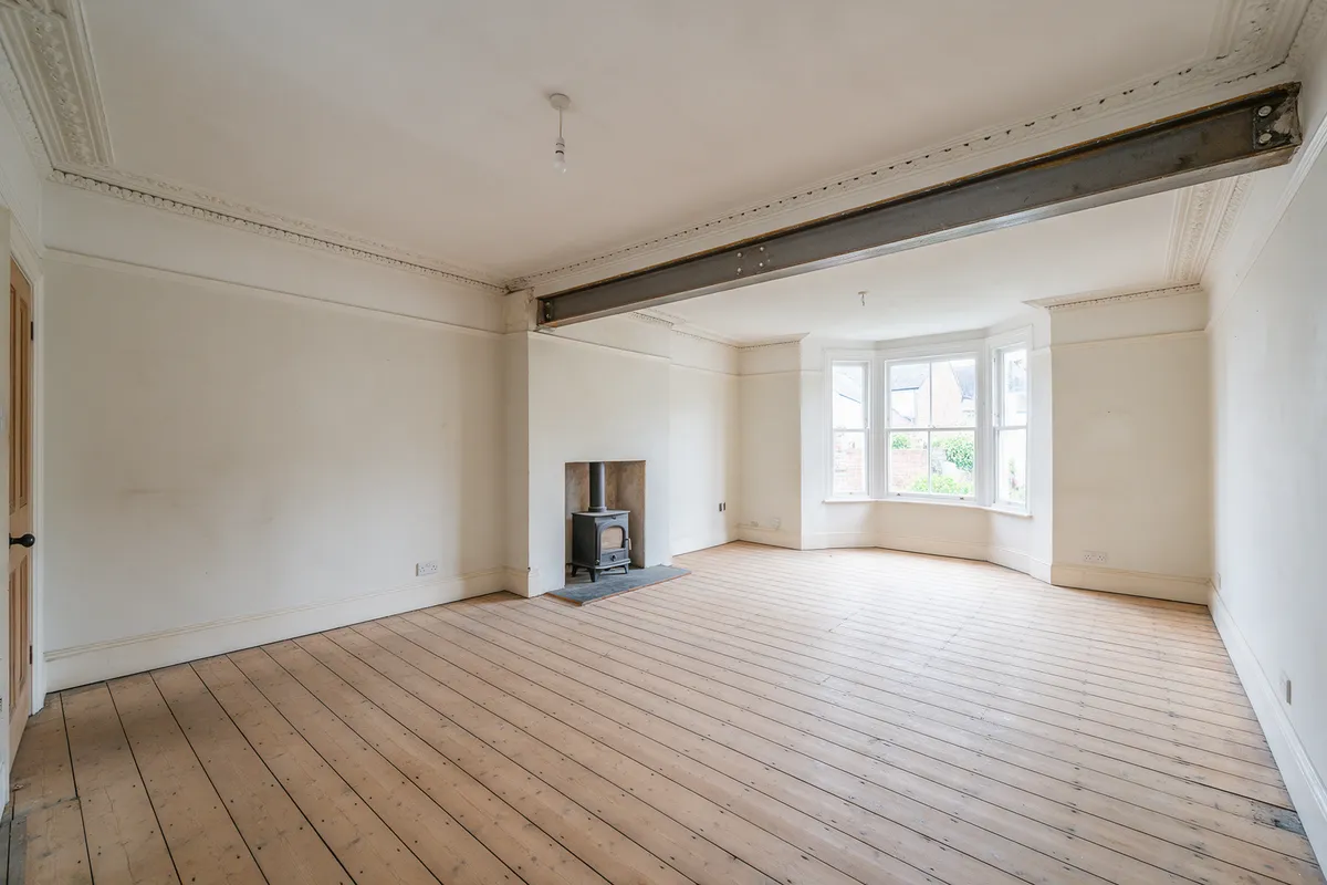 A renovated Victorian terrace interior knocked through into one open-plan room with restored cornicing